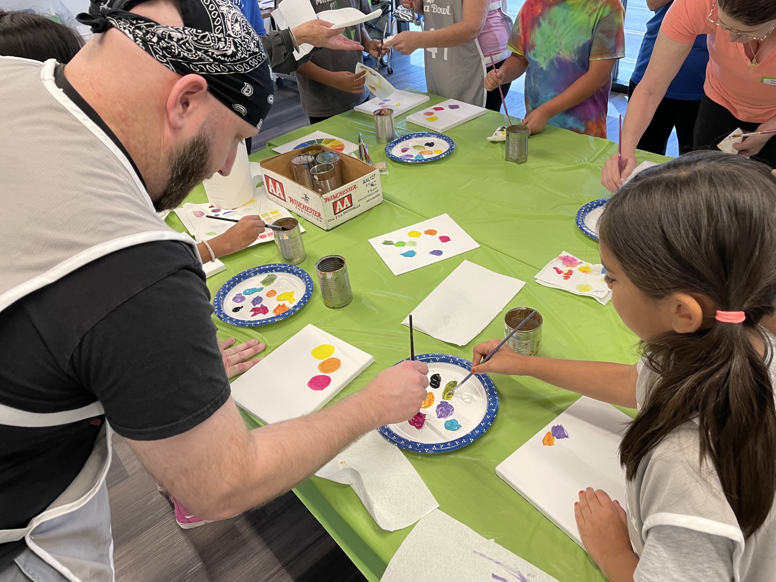 Participants painting for Foster Families and Kinship program